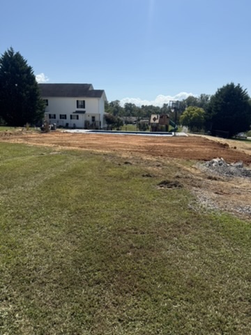Residential yard grading completed behind a Dandridge-area home